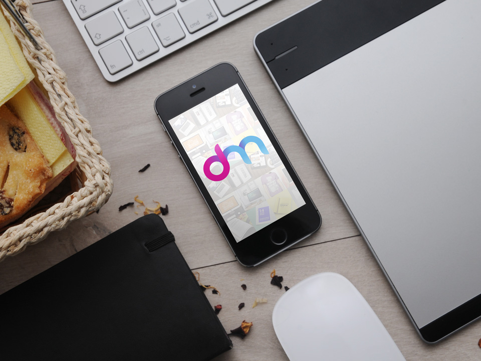 iPhone on Table Mockup Free PSD