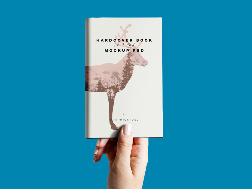 Hand holding Hardcover Book Mockup