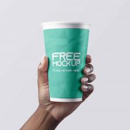 Coffee cup in hand mockup
