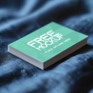 Realistic business card stack on fabric mockup